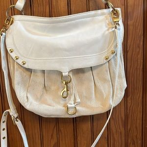 White material and faux leather Rebecca Minkoff bag. gold hardware.